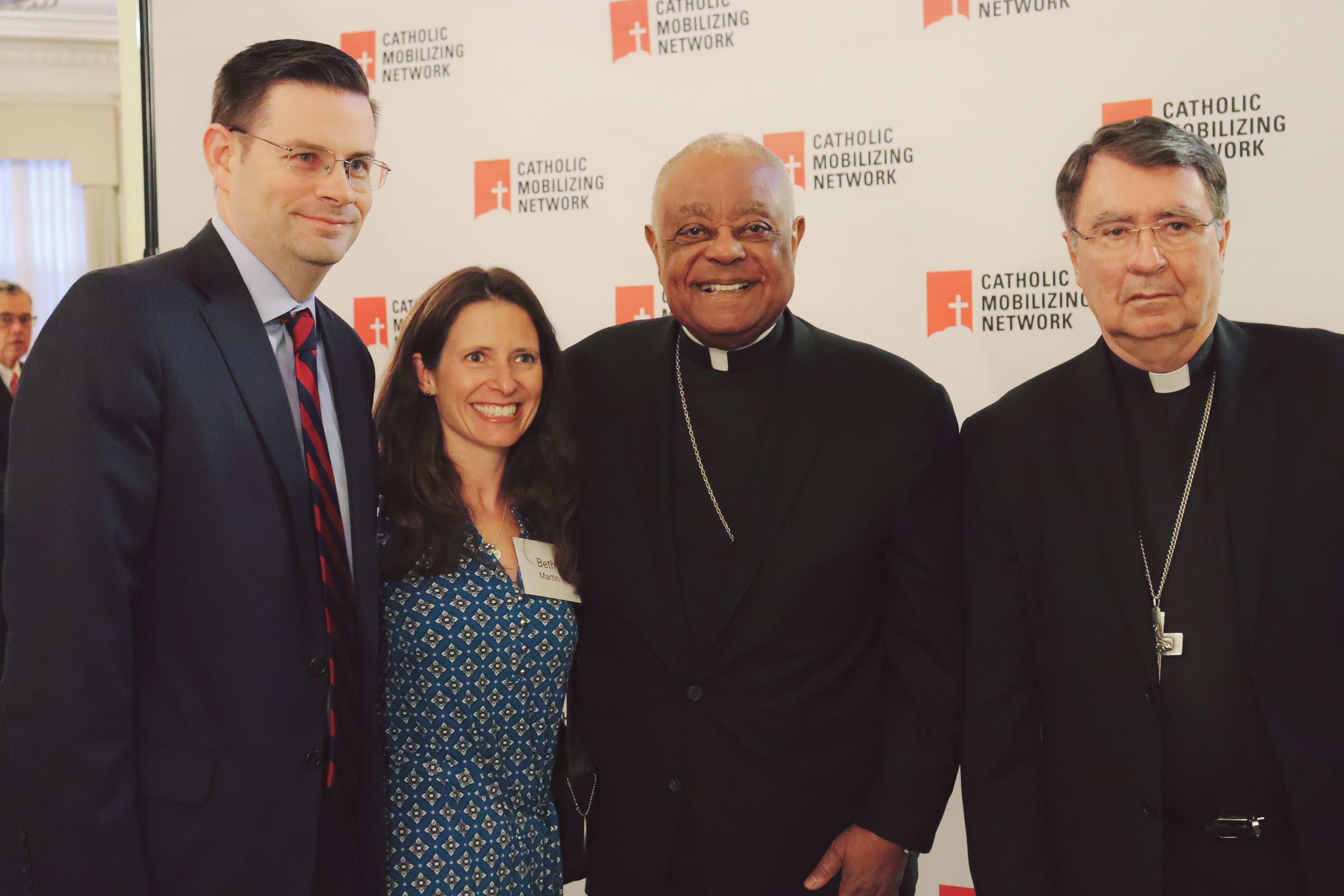 Guests stand with Cardinal Gregory and Abp. Pierre