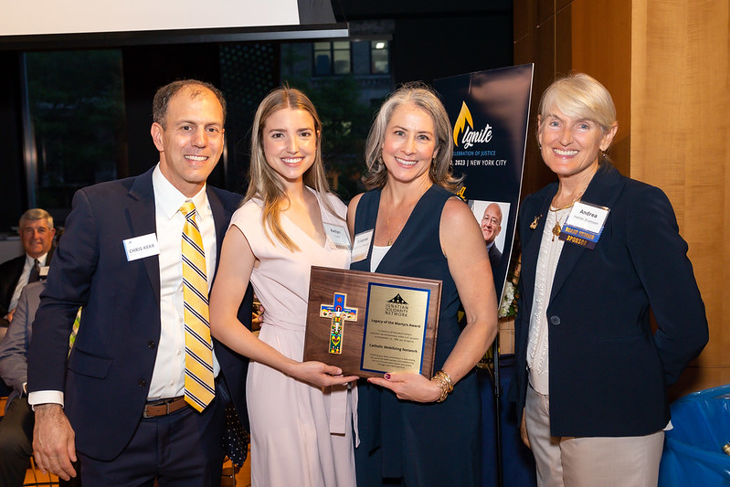 CMN executive director Krisanne Vaillancourt Murphy and communications director Katlyn Toelle with &quot;legacy of the martyrs&quot; award