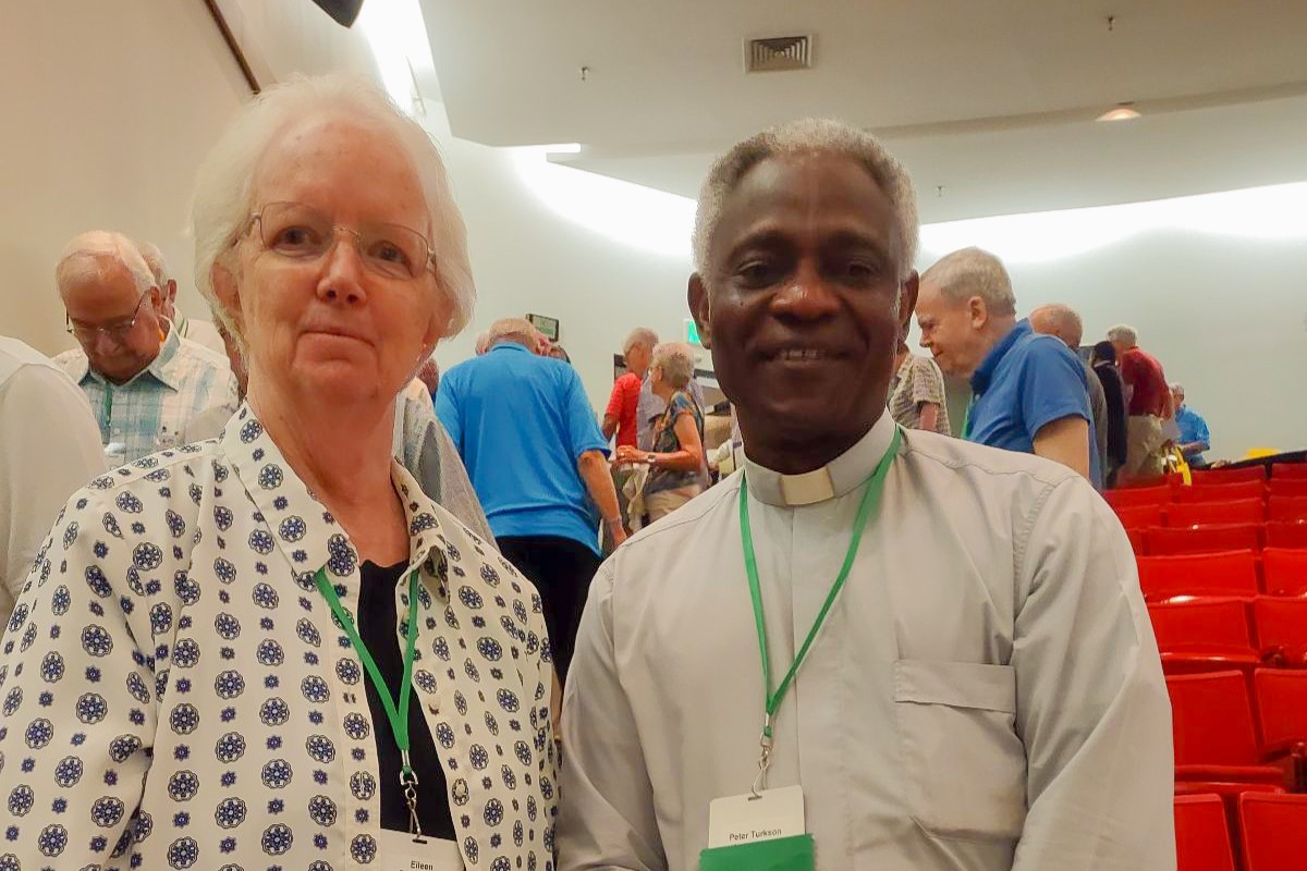 CMN Religious Engagement Associate Sr. Eileen Reilly, SSND smiles alongside Cardinal Peter Turkson, Chancellor of the Pontifical