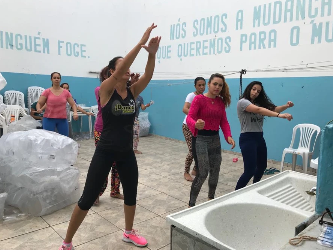 women dancing in prison