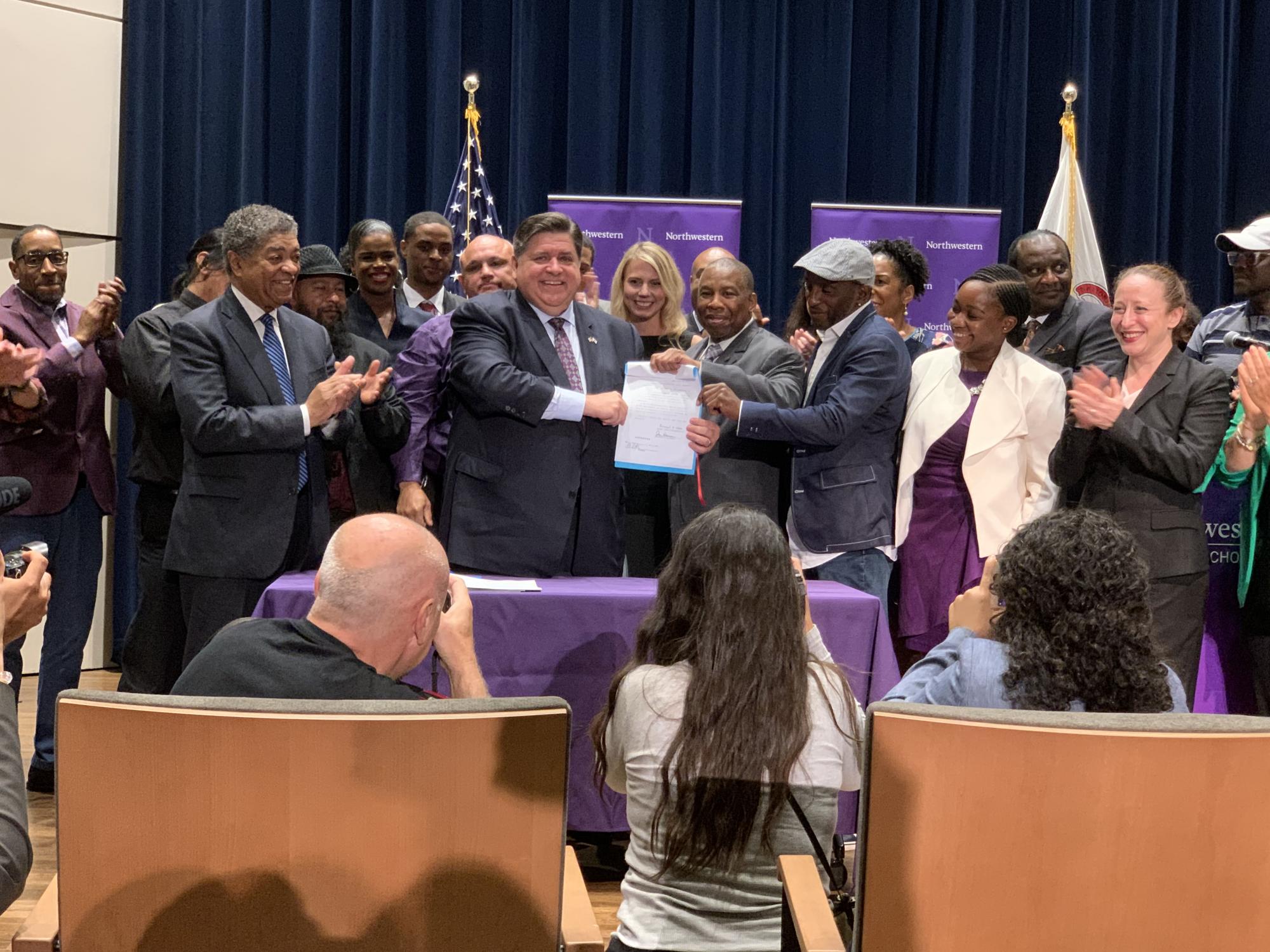 Illinois Governor J.B. Pritzker signs Senate Bill 64 into law.