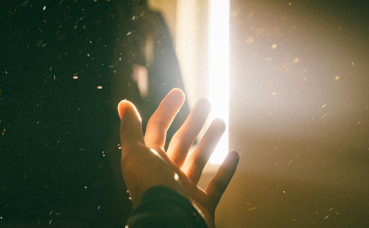 hand basking in lightbeam