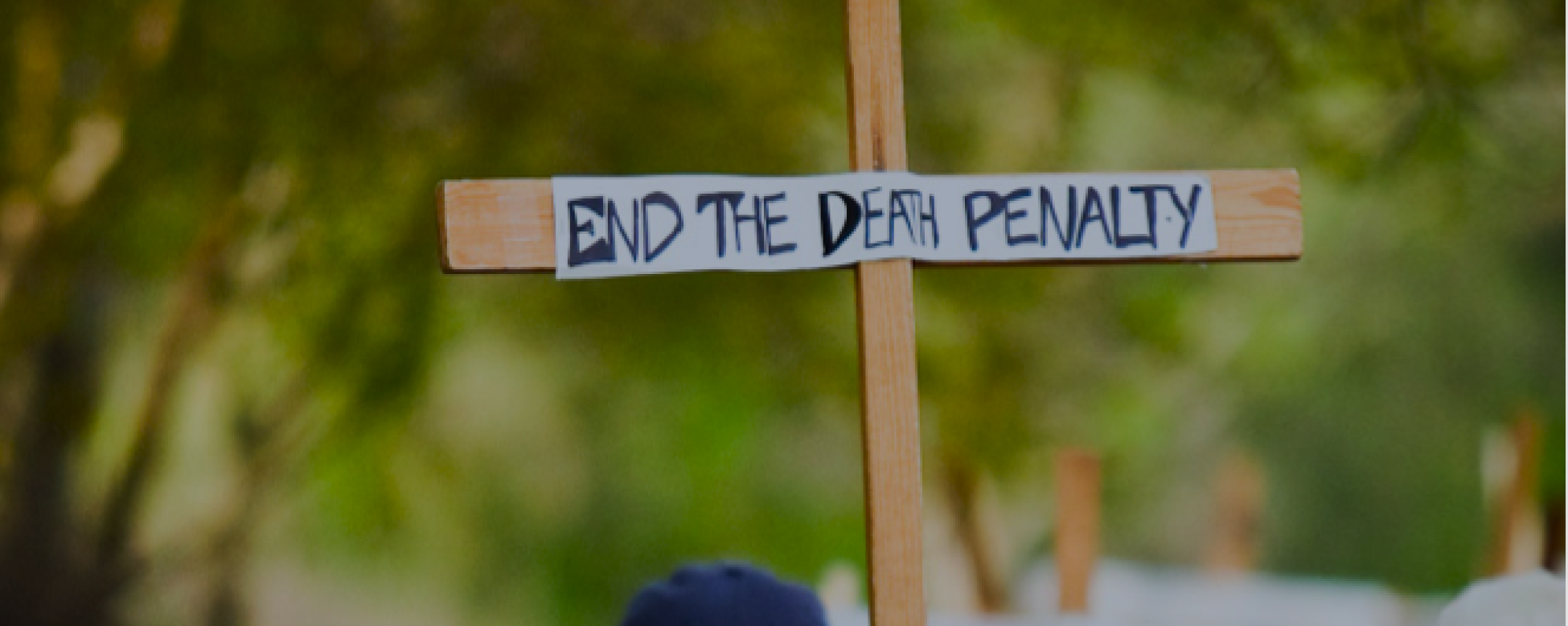 Cross in the air that says "end thedeath penalty"