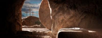 Looking out from the tomb at three crosses