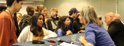 Krisanne Vaillancourt Murphy, executive director of CMN, talks to students after a presentation