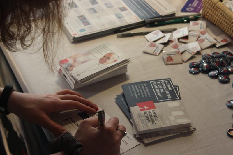 Person signs the "national Catholic pledge to end the death penalty"