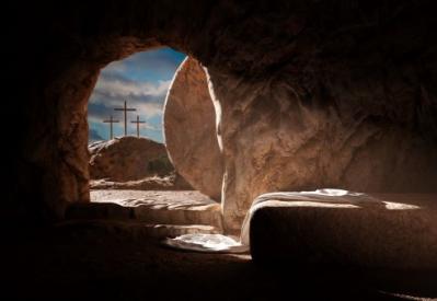 Looking out from the tomb at three crosses