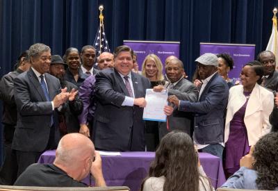 Illinois Governor J.B. Pritzker signs Senate Bill 64 into law.