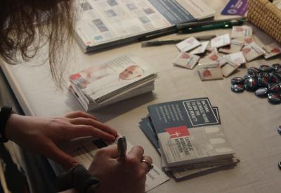 Person signs the "national Catholic pledge to end the death penalty"