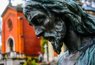 Statue of Jesus with water dripping down his face