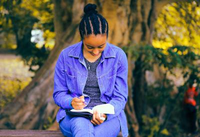 Young woman writing 